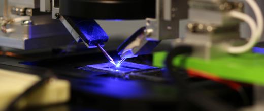 close up of soldering a microchip